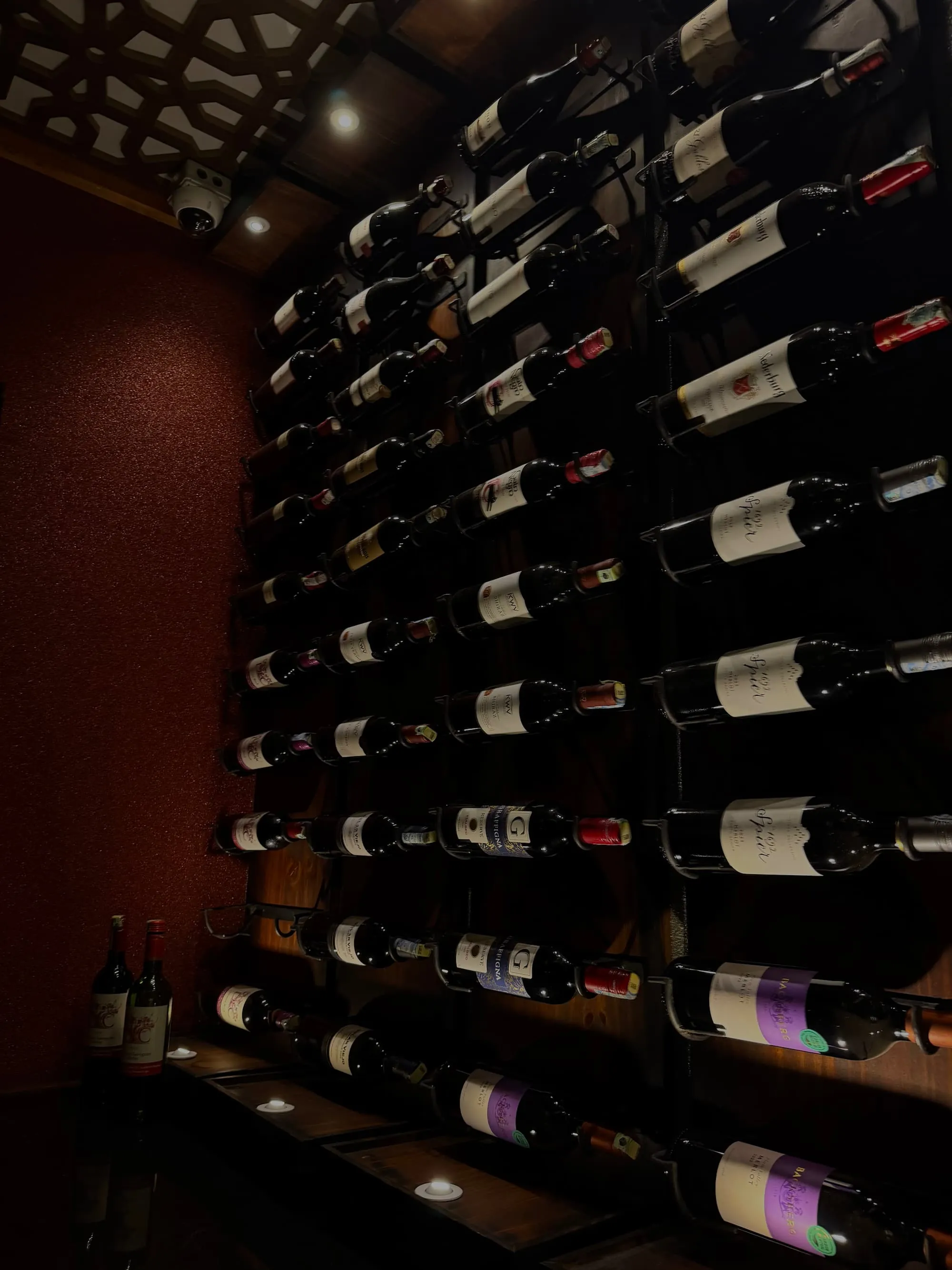 Amber's illuminated wall of wine bottles